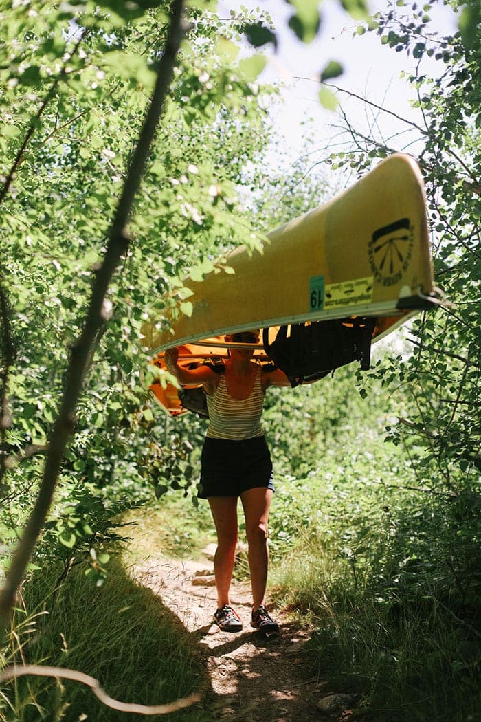 Fit Foodie Finds portaging a canoe in the BWCA