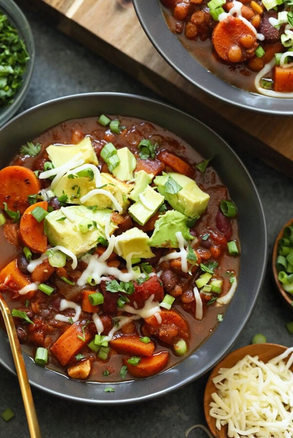 Vegan chili with avocado and cheese.