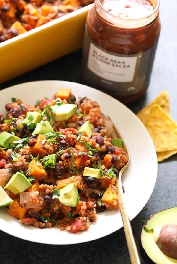 a plate of black bean and sweet potato casserole with avocado.