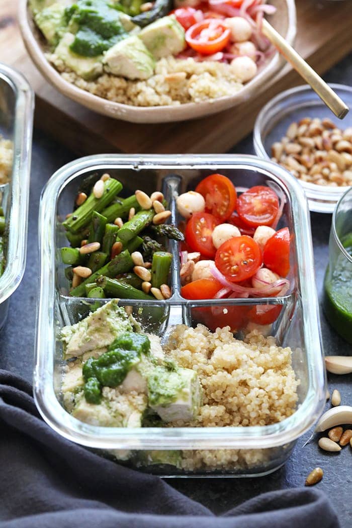 Pesto chicken and sides in a meal prep container ready to be taken to lunch