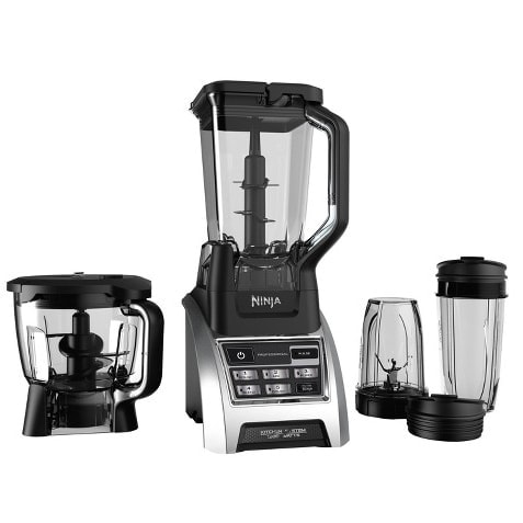 A Ninja blender with a cup and two bowls on a white background.