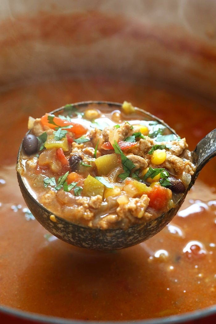 A ladle full of taco soup.