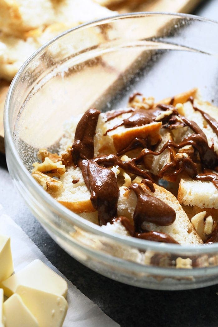 cinnamon roll french toast casserole ingredients in a bowl