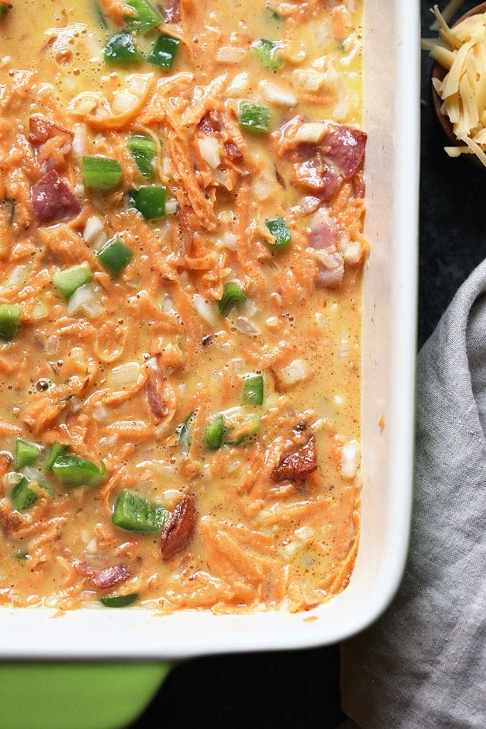 Breakfast casserole ingredients in a casserole dish