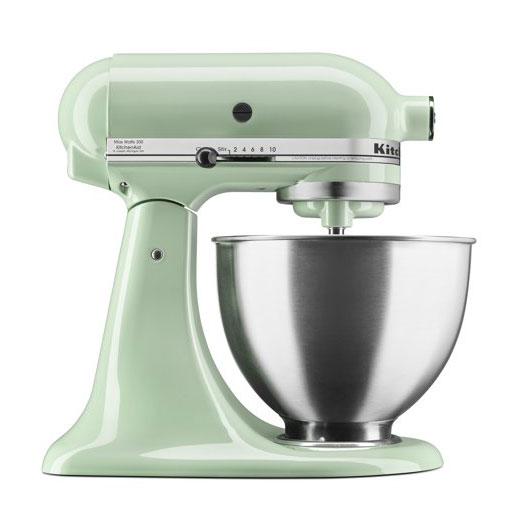 A green-bowled KitchenAid mixer displaying a soft pretzel recipe against a white background.