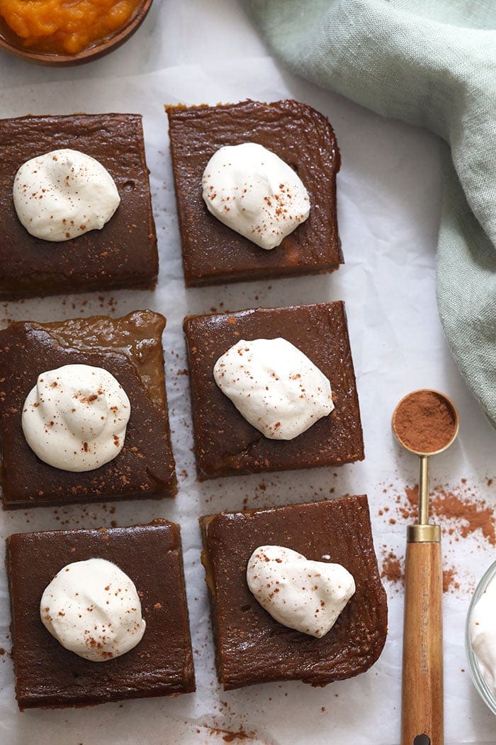 Pumpkin pie bars with whipped cream topping