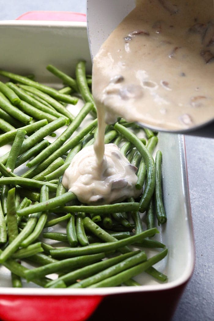 pouring gravy on green beans