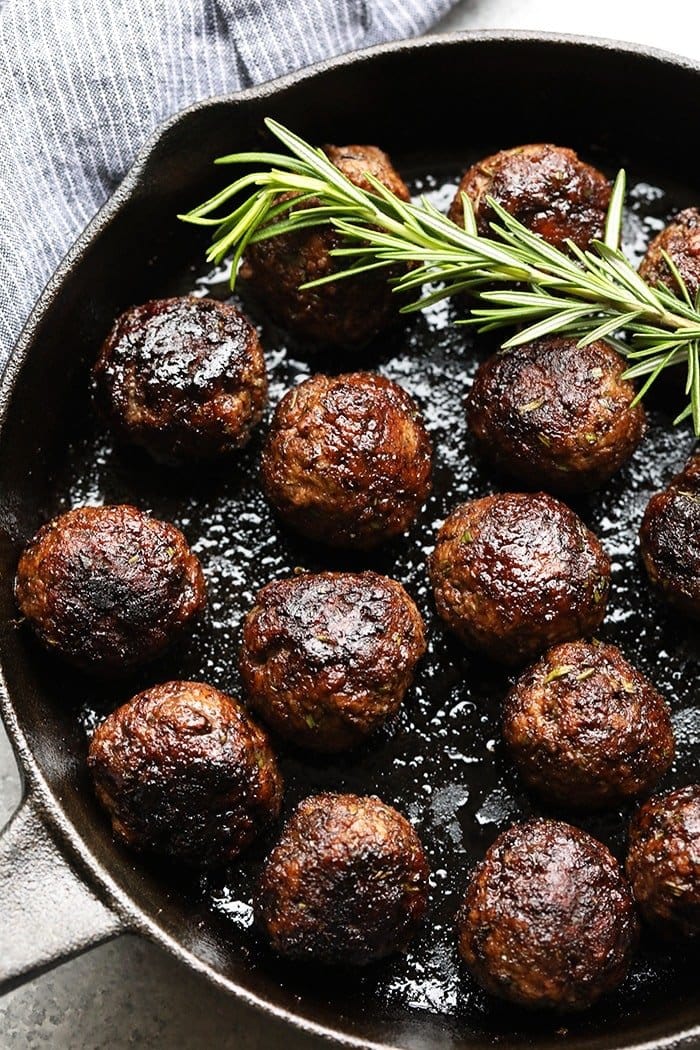 Rosemary Thyme Balsamic Meatballs in a cast iron pan