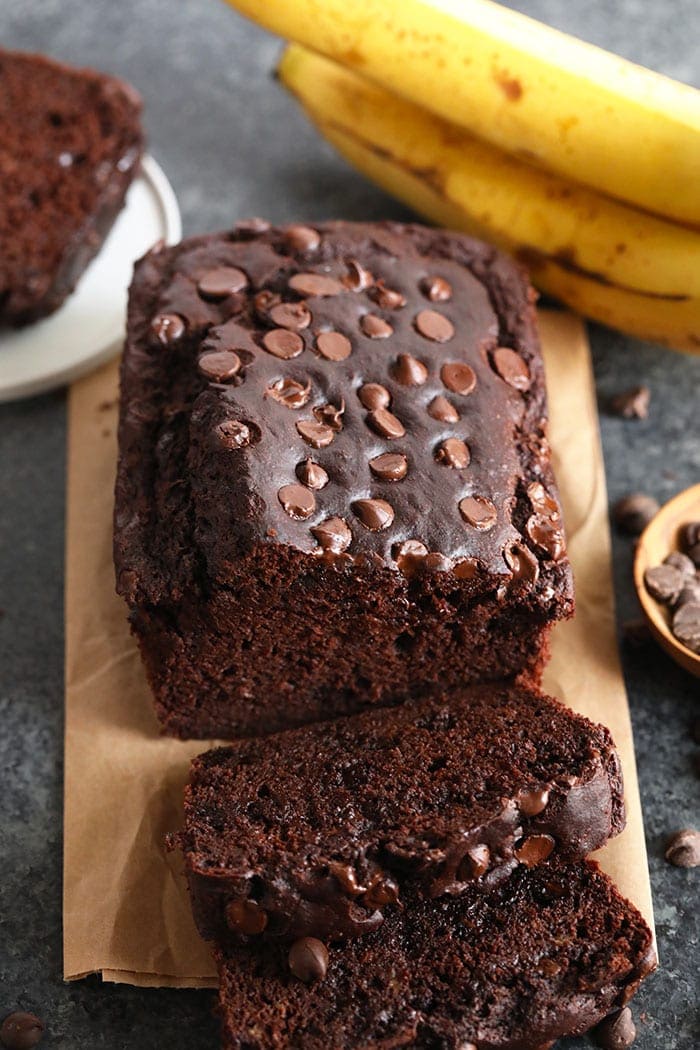 banana bread on counter with bananas