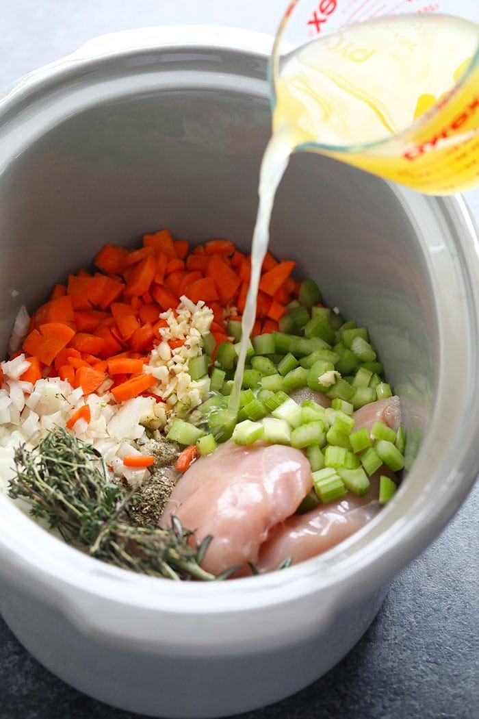 ingredients in crockpot with broth