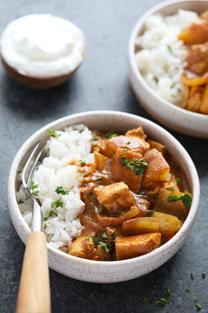 slow cooker chicken tikka masala in a bowl with rice