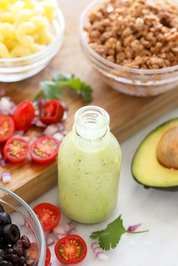 A jar of avocado cilantro lime dressing