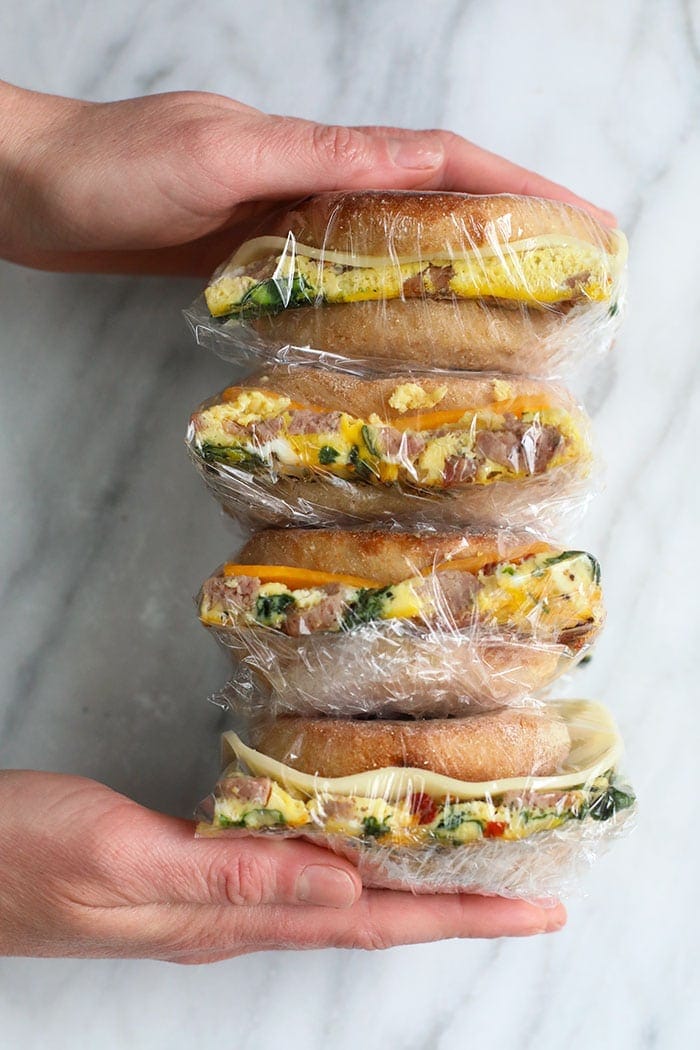 freezer breakfast sandwiches wrapped in plastic wrap.