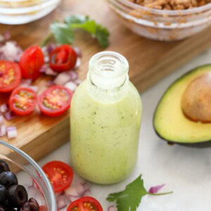 A jar of avocado cilantro lime dressing