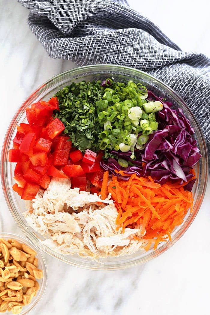 thai peanut chicken salad ingredients in a bowl