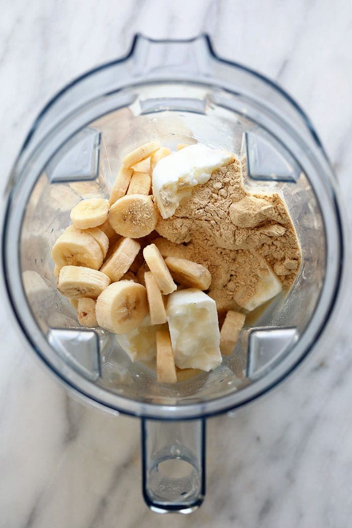 healthy banana protein shake ingredients in a blender