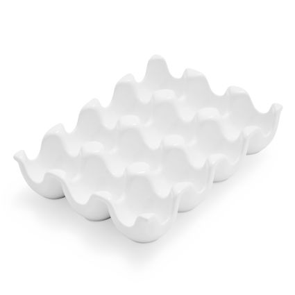 An empty white egg tray on a white surface.