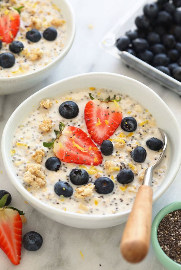 Two bowls of overnight oats with blueberries and chia seeds.