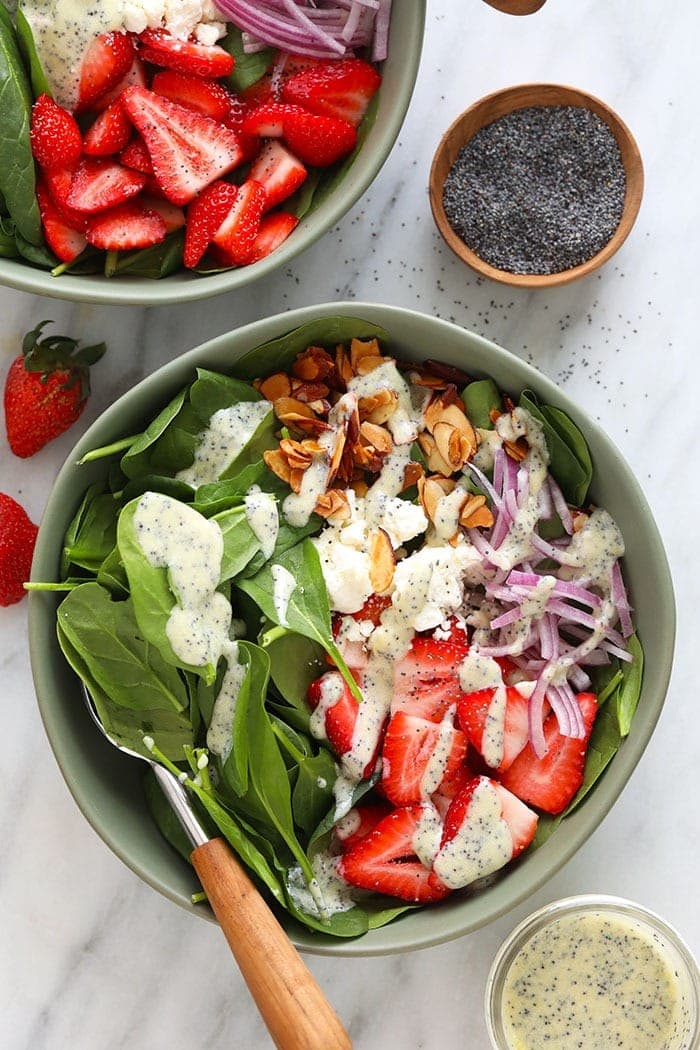 Strawberry spinach salad with poppy seed dressing in a bowl! 