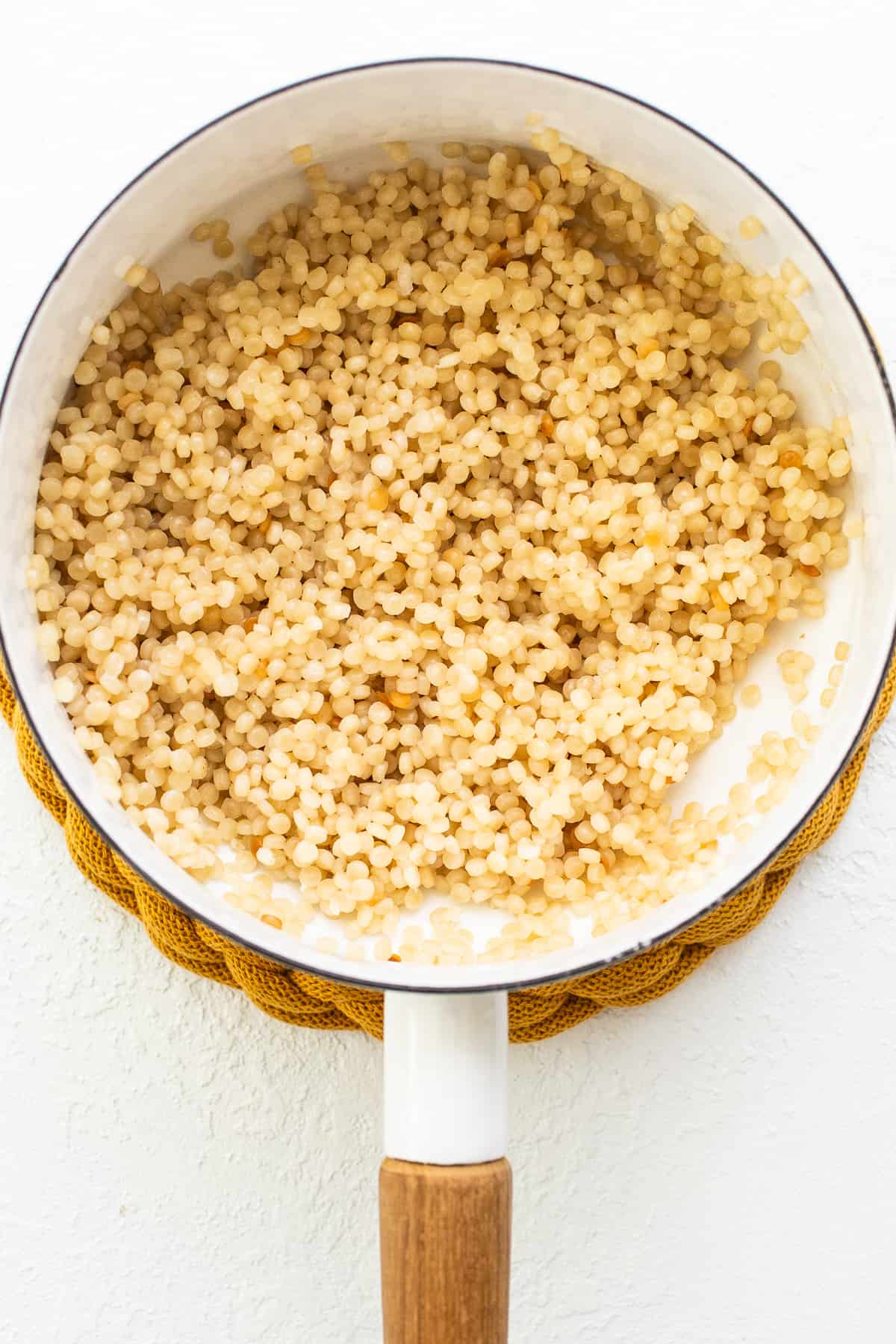 Israeli couscous in pot.