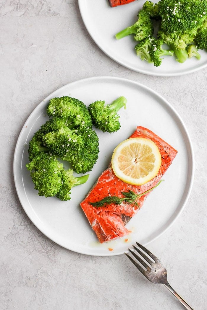 sous vide salmon on a plate with broccoli