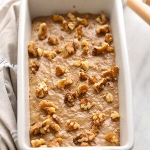 Vegan banana bread with walnuts on top.