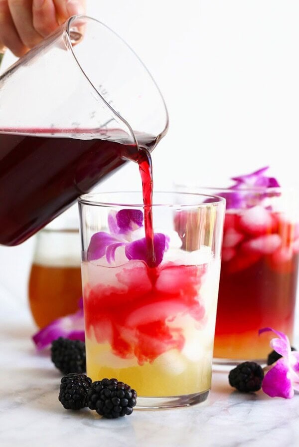 hibiscus arnold palmer drink being poured in a glass