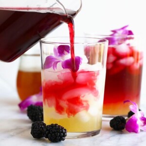 hibiscus arnold palmer drink being poured in a glass