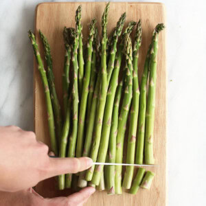 slicing asparagus.