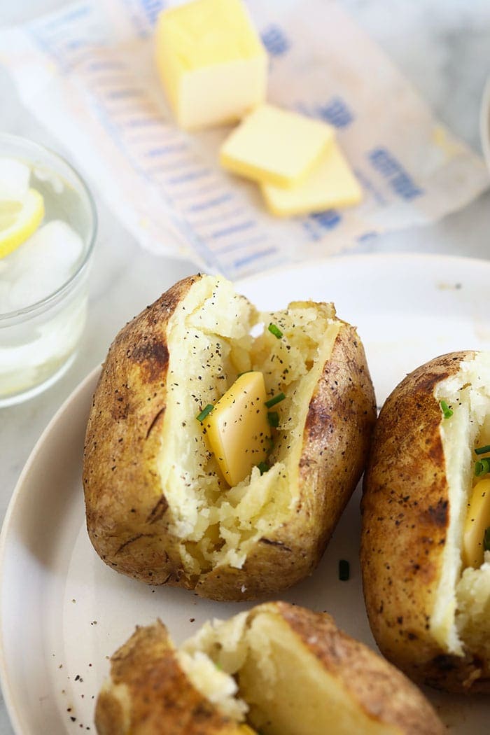 baked potato in foil with butter