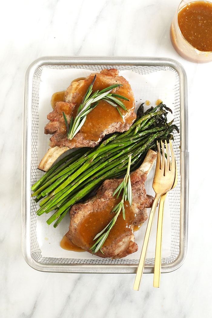 2 pork chops and gravy with asparagus