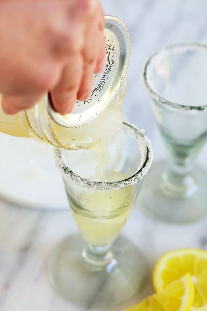 Pouring lemon drop into a glass