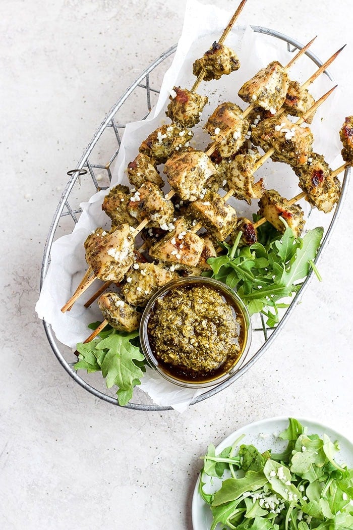 grilled chicken skewers in a basket.