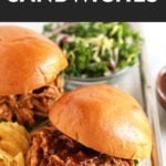 Slow cooker pulled chicken sandwiches on a tray.