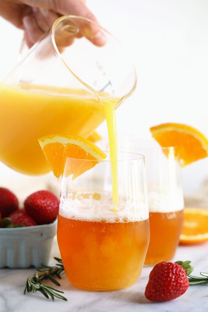 Pouring orange juice into a glass