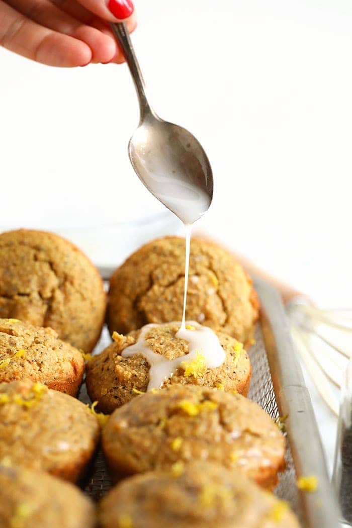 Drizzling icing onto lemon poppy seed muffins