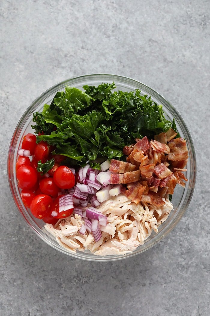 healthy BLT chicken salad ingredients in a bowl