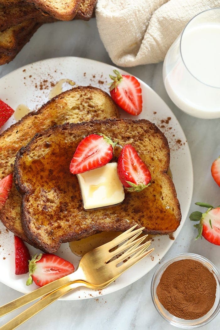 sheet pan french toast on a plate with strawberries