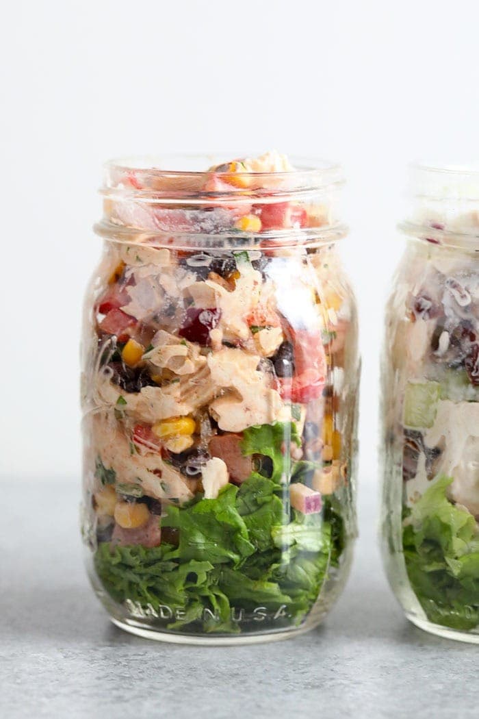 southwest salad in mason jar with lettuce.