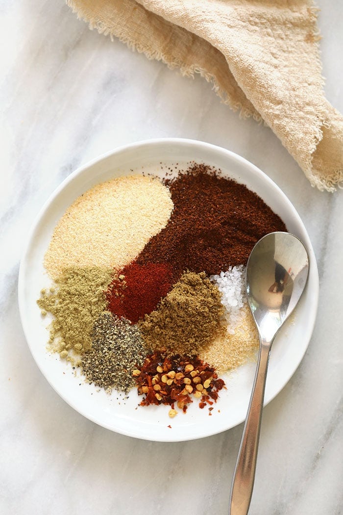 Homemade taco seasoning ingredients on a plate.