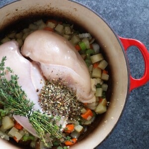 Creamy chicken noodle soup with vegetables and herbs.