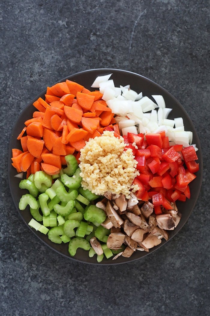 chicken noodle soup ingredients on a plate