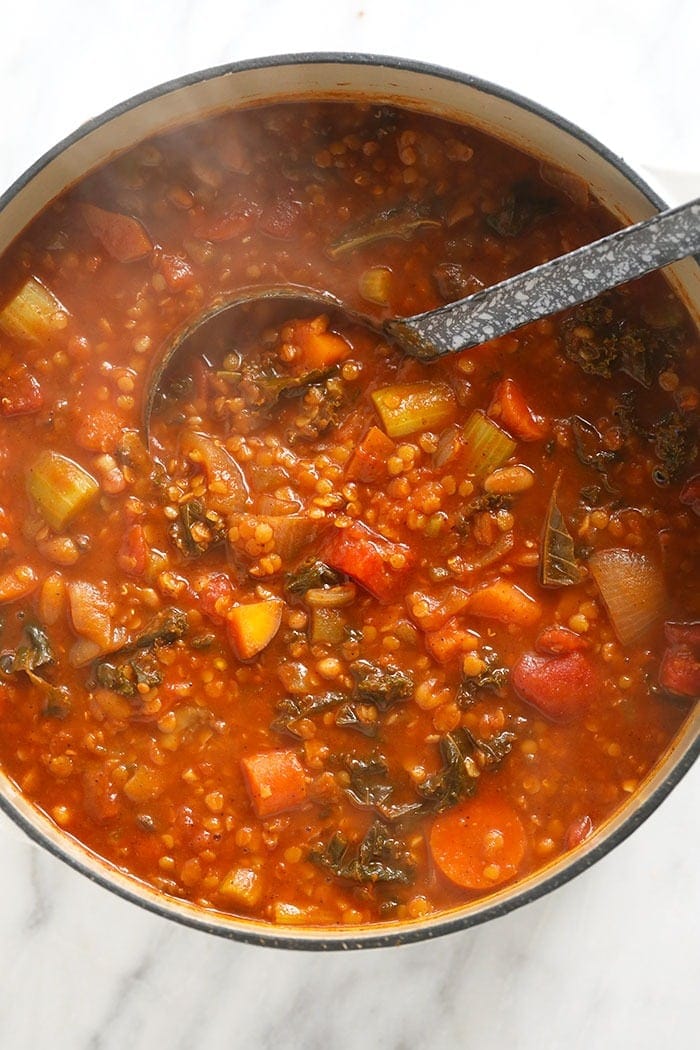 Finished lentil stew ready to eat with a ladle in it! 