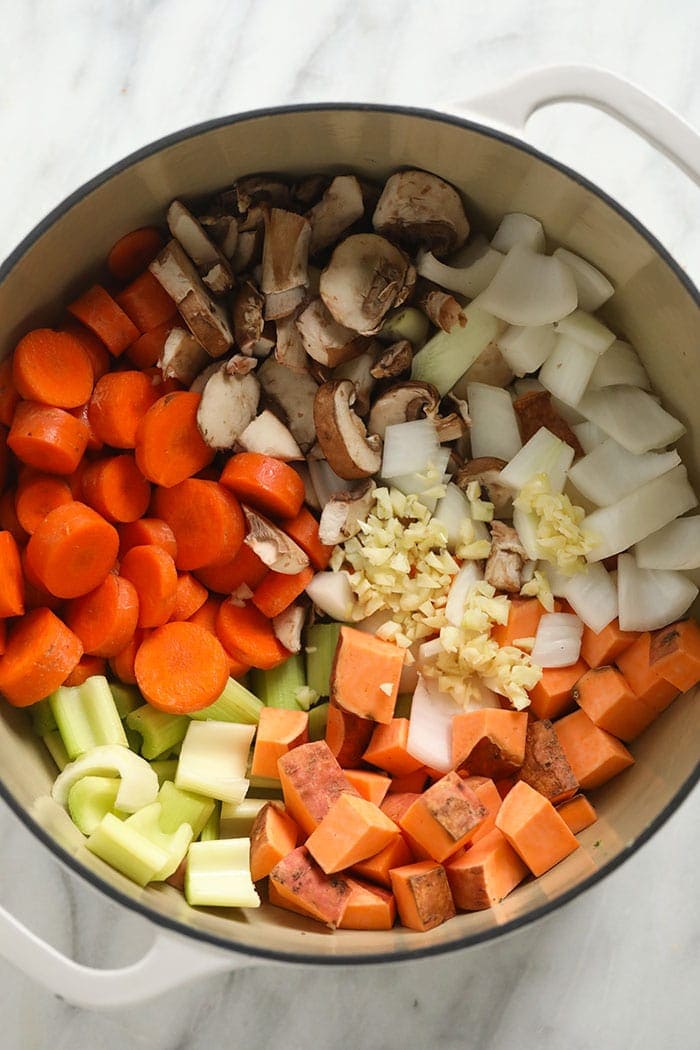 Raw ingredients for the sweet potato lentil stew in a pot. 