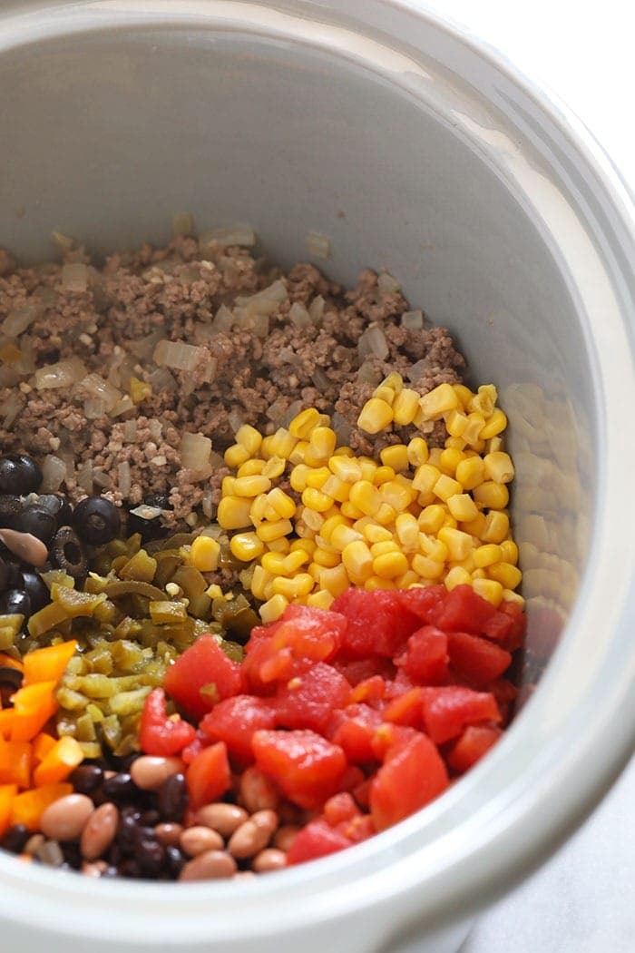 slow cooker taco soup ingredients in a slow cooker