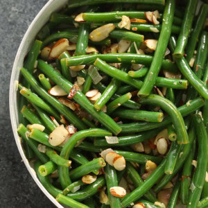 Green beans almondine cooked in a skillet.