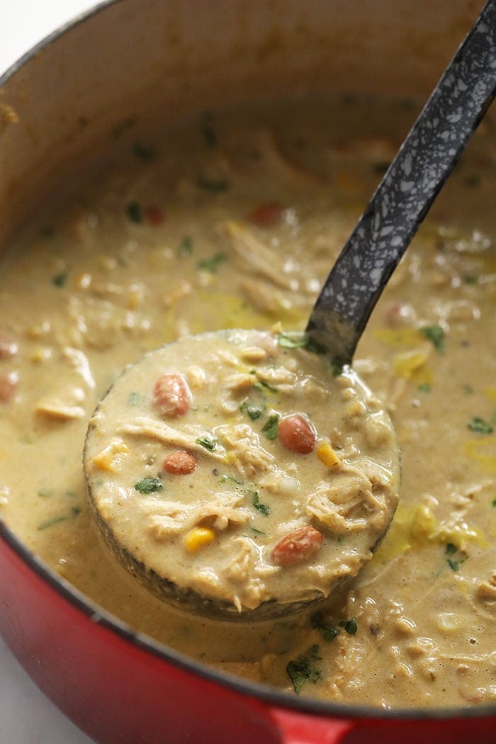 white bean chicken chili on a ladle.