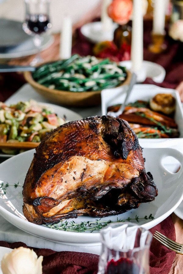 Thanksgiving dinner featuring a delicious Sous Vide Turkey alongside roasted vegetables.