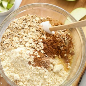 Apple pie bars with oats, oat bran, cinnamon and apples elegantly displayed on a cutting board.