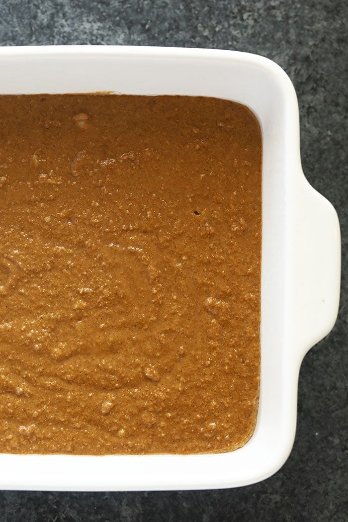 gingerbread in a square baking pan ready to be put in the oven